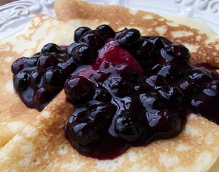 blueberry sauce served over buttermilk crepes