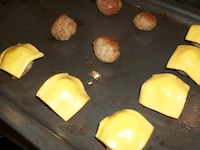 burgers in a pan with cheese