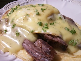 crepes with steak, eggs, and bearnaise sauce