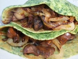 spinach crepes filled with mushrooms and onions