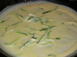 zucchini crepes in a pan