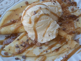 butterscotch sauce over ice cream and crepes