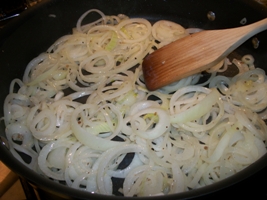 sliced onions in saute pan