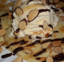 toasted almonds over ice cream and crepes