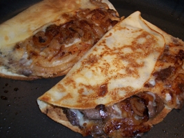 philly steak sandwich crepes in a pan