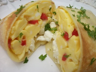 scrambled eggs, roasted red peppers and feta cheese in crepes