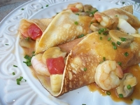 Shrimp, Fish, Scallops, and Mushroom Crepes in a Savory Tomato-Saffron Sauce